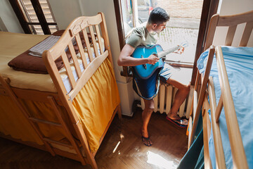 Colourful art hostel in old town with budget-friendly dorms, painted walls, shared kitchen, urban...