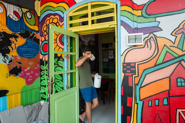 Colourful art hostel in old town with budget-friendly dorms, painted walls, shared kitchen, urban...