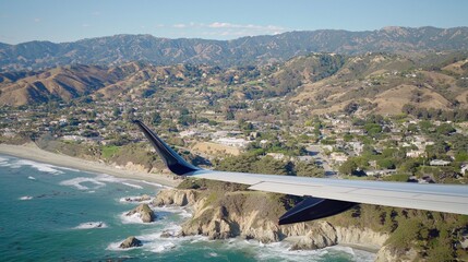Fototapeta premium High-angle view of coastal landscape from airplane wing.