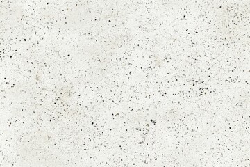 Fototapeta premium Worn concrete surface with small dark speckles ideal for industrial design, product mockups and urban backgrounds