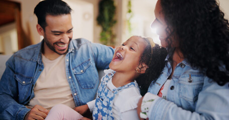 Parents, girl and tickle on sofa, laugh and bonding with love, comic joke and relax in lounge at...