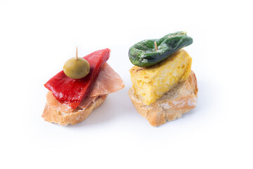 Traditional Spanish pintxos isolated on white background. 