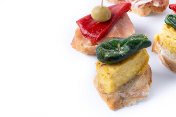 Traditional Spanish pintxos isolated on white background. Copy space