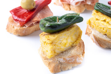 Traditional Spanish pintxos isolated on white background. 
