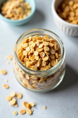 Dry oat flakes in a glass jar, top view Natural, vegan breakfast , grain, brunch, food photography