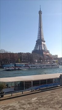 Beautiful view of famous Eiffel Tower in France with magical morning cloud and fog.