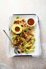 Warm quinoa salad with avocado and meat