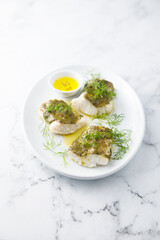 White fish fillet with herbs