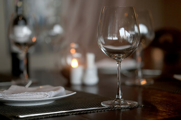 table setting in the restaurant, glasses and cutlery, a clean new table in the restaurant is waiting for guests, a free table