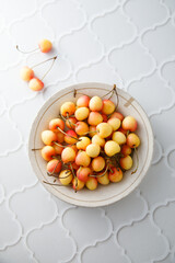 Pink cherry in a bowl