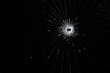 Obraz premium Bullet holes on black glass, overlay design background