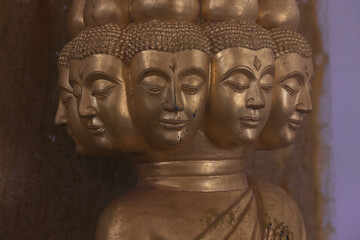 Multi-faced Asian god, close-up statue