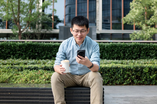 asian businessman working with samrt phone out of office
