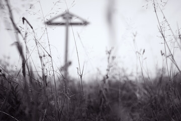 old wooden cross of worship in the Arkhangelsk region Orthodox shrine, landscape of the Russian north