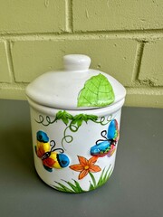 Glass Sugar Jar with Lid on Wooden Table