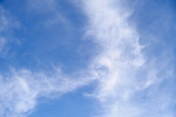 Fototapeta premium The sky is blue and clear with a few clouds scattered throughout