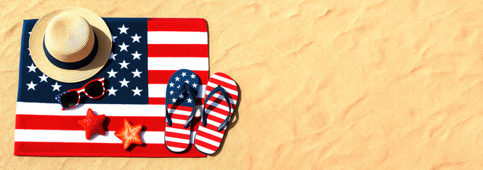 Fototapeta premium Creative banner of beach items with USA flag design including hat, sunglasses, flip-flops, towel, strawberry slices in the form of stars on sand. Concept of independence Day America 4th of July