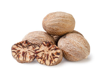 Heap of nutmeg and pieces on a white background. Isolated