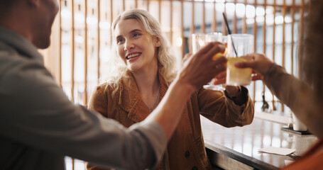 Restaurant, happy and friends cheers with cocktails for social gathering, event and party. Bar, toast and group of men and women with alcoholic beverage for holiday, celebration and weekend fun