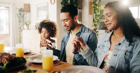 Dinner, parents and child holding hands with prayer in home for grace, gratitude and thankful for food. Spiritual family, people and blessing lunch with thanksgiving, religious and praise together