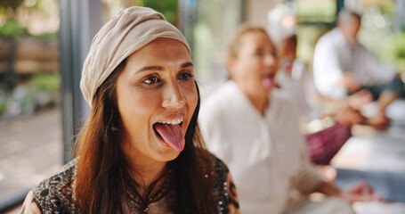 Breathing, meditation and tongue out with woman in yoga class for pranayama or stress relief. Fitness, lions breath and wellness with yogi people in studio for balance, inner peace or mental health