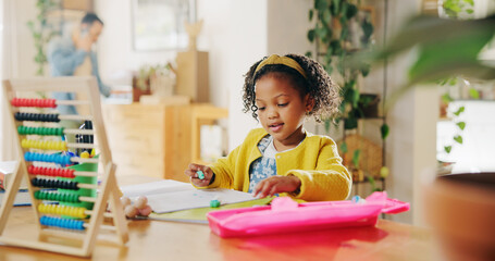 Home, studying and child with notebook, education and learning for elementary with abacus and...
