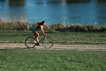 young woman riding a bicycle