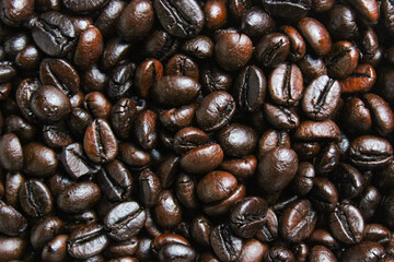 Pile of roasted coffee beans. Coffee beans background