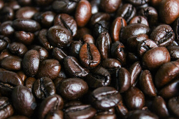 Pile of roasted coffee beans. Coffee beans background