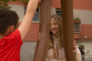 Children enjoy their delightful playtime at a lovely park, enthusiastically engaging with a...