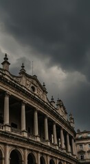 Fototapeta premium Dramatic stormy sky over classical European building with ornate columns and architecture. Moody atmospheric cityscape showcasing historical landmark in ominous weather