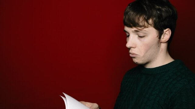 Young attractive man preparing for exams