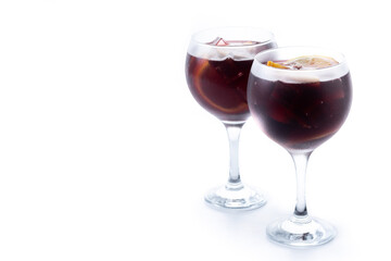 Refreshing Summer Citrus Fruit Sangria in crystal glass isolated on white background. Copy space