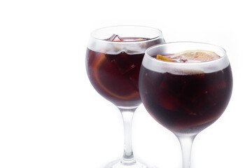 Refreshing Summer Citrus Fruit Sangria in crystal glass isolated on white background. Copy space