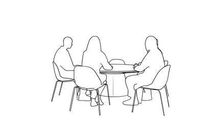 Three people are sitting around a table, with one person holding a book