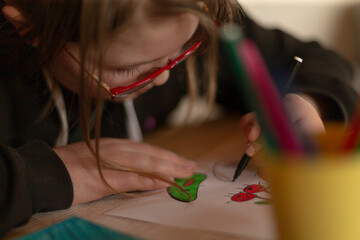 Teen girl portrait. Teenage girl wears stylish red-framed eyeglasses, combining practicality with...
