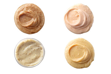A top down view of four different sauces with varying colors and textures on a black background