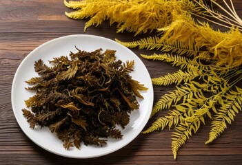There's a plate of seaweed on the wooden table