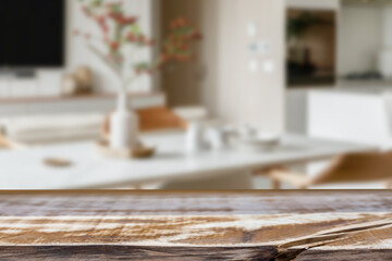 Empty wooden kitchen counter mockup, product display background. Wood table top on marble, blurred interior. Modern style home kitchen, restaurant advertising. Copy space for food, drinks, dishes