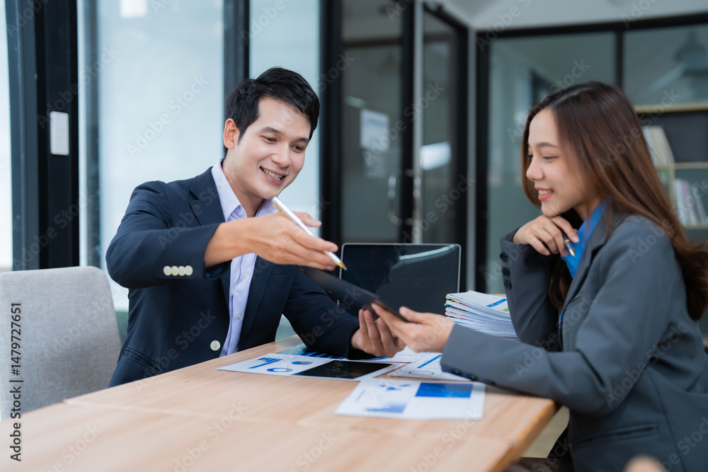 Poster two asian businesspeople are discussing and working together with happiness in the office, analyzing