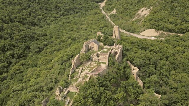 Aerial zoom in view Ujarma Fortress. Ancient Hilltop Royal Citadel and Strategic Stronghold of the Iberian Kings in Kakheti, Georgia. Sightseeing destination in Kakheti wine region