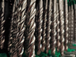 Close up of drill bits showing sharp edges and spiral grooves