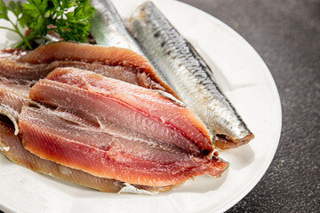 Sardine raw fish fillet seafood anchovy filet fresh delicious gourmet food background on the table rustic food top view copy space pescetarian diet