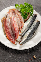 Sardine raw fish fillet seafood anchovy filet fresh delicious gourmet food background on the table rustic food top view copy space pescetarian diet