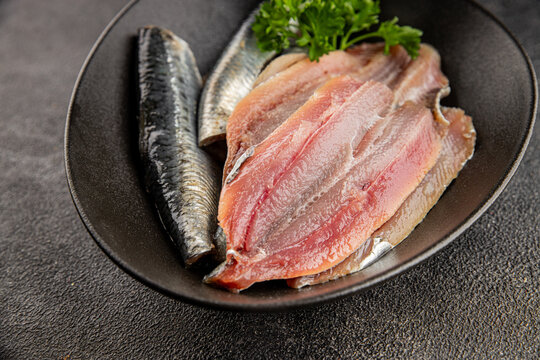 Sardine raw fish fillet seafood anchovy filet fresh delicious gourmet food background on the table rustic food top view copy space pescetarian diet