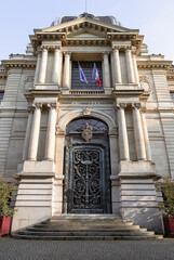Obraz premium Exterior architectural design of The Paris Chamber of Commerce and Industry building (Chambre de commerce de Paris) is a French chamber of commerce that supports businesses in Paris. Space for text.