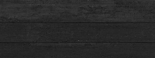 Dark, horizontal, textured surface.  A deep,  uniform black  material with horizontal  lines.  Slight variations in texture