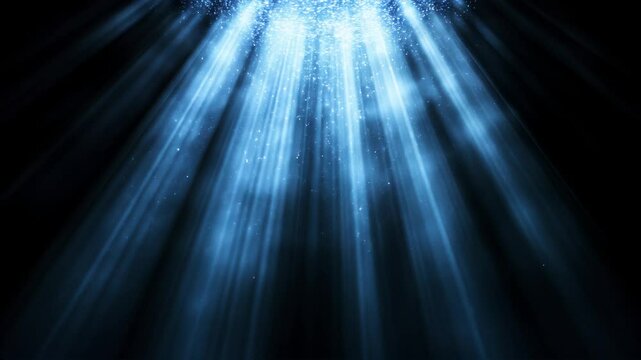 Rayos de luz azul descendente con part&iacute;culas brillantes sobre fondo oscuro &ndash; Animaci&oacute;n fija atmosf&eacute;rica