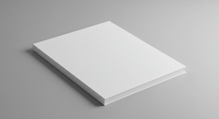 Elegant blank white book mockup on a neutral gray surface, promoting creative content