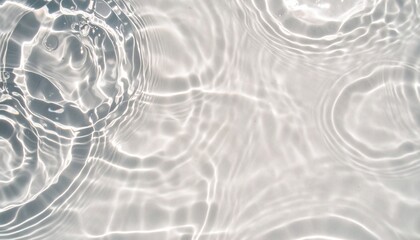 Blue water with ripples on the surface. Defocus blurred transparent blue colored clear calm water surface texture with splashes and bubbles. Swimming pool top view close up.	